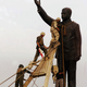 Marines pull down a statue of Saddam Hussein in al-Fardous Square, 2003. Image via Getty.